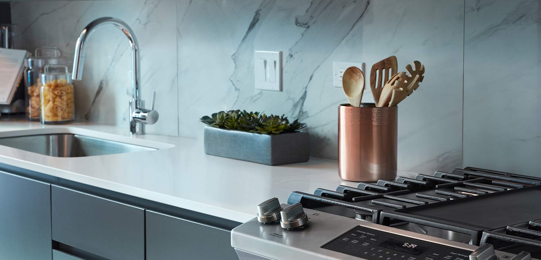 Elevate your living experience in an apartment with sleek stainless steel appliances, combining modern style with high performance.